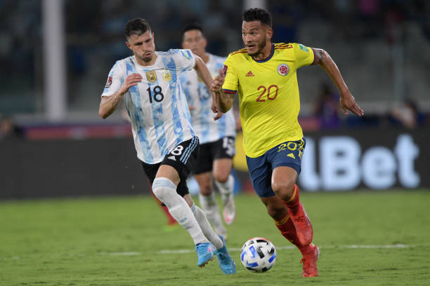 Argentina's Guido Rodriguez and Colombia's Luis Javier Suarez vie for the ball during the South American qualification football match for the FIFA...