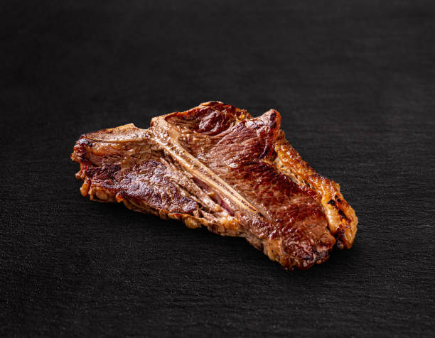 argentinian beef tbone steakcloseup of meat on barbecue grill picture id1392614093?k=20&m=1392614093&s=612x612&w=0&h=BrJEQtQOmv2g5rNvnruU IjjFjI8263K6sK17F8dWYI=