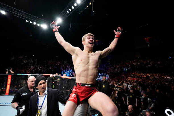 Arnold Allen of England celebrates his TKO victory over Dan Hooker of New Zealand in a featherweight fight during the UFC Fight Night event at O2...