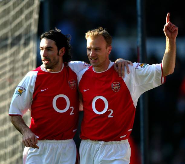 Arsenal's Dennis Bergkamp celebrates with team-mate Robert Pires after scoring against Manchester City during their FA Barclaycard Premiership match...