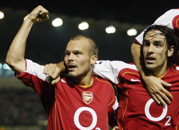 Arsenal's Freddie Ljungberg celebrates scoring the opening goal with Robert Pires against Panathinaikos during the UEFA Champions League Group E...