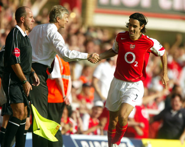Arsenal's Robert Pires celebrates with manager Arsene Wenger after his goal