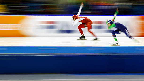 Artur Was of Poland and Kai Verbij of The Netherlands competes in the mens 500m race during day three of the ISU World Cup Speed Skating Finals held...