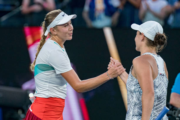 Ashleigh Barty of Australia shakes hands with Amanda Anisimova of United States after winning match point in her fourth round singles match during...