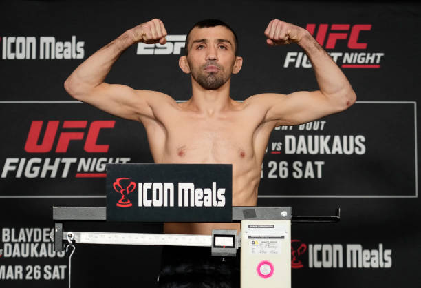 Askar Askarov of Russia poses on the scale during the UFC Fight Night official weigh-in at the Renaissance Hotel on March 25, 2022 in Columbus, Ohio.