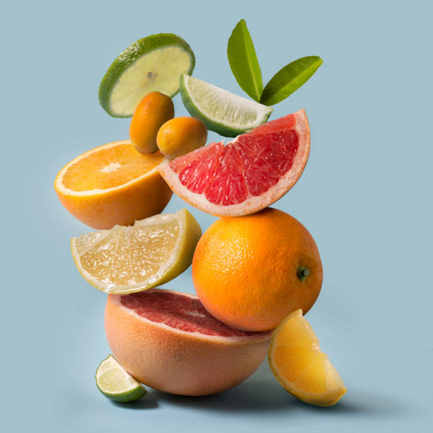 assorted citrus fruits stack still life. - vitamin c stock pictures, royalty-free photos & images
