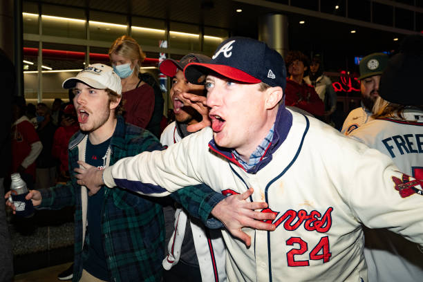 Atlanta Braves fans celebrate as they follow Game Six of the World Series against the Houston Astros on November 2, 2021 in Atlanta, Georgia. The...