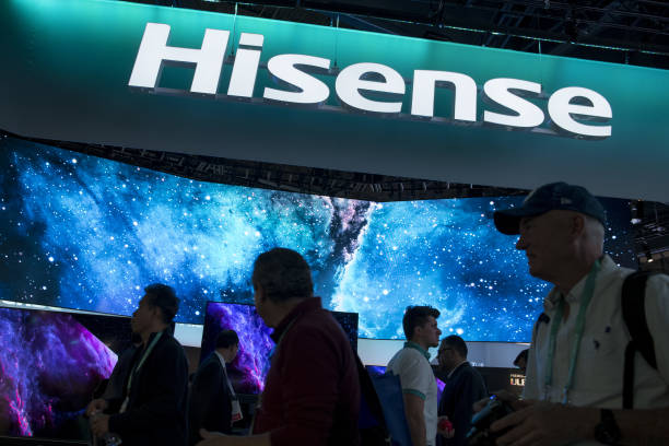 attendees walk past the hisenseelectric cobooth at ces 2020 in las picture