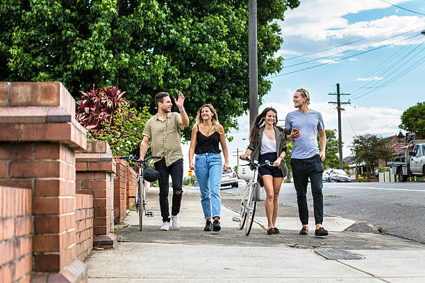 Australian friends walking in the street on a sunny day.