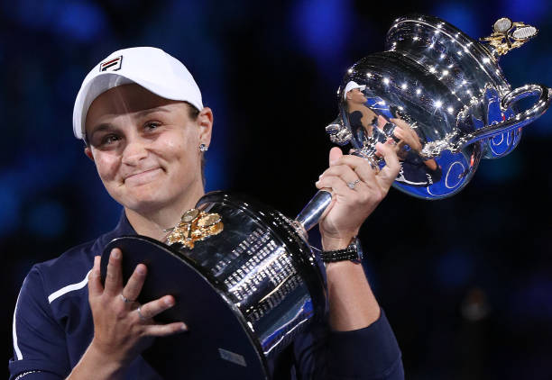 Australia's Ashleigh Barty poses with the trophy after victory in her womens singles final match against Danielle Collins of the US on day thirteen...