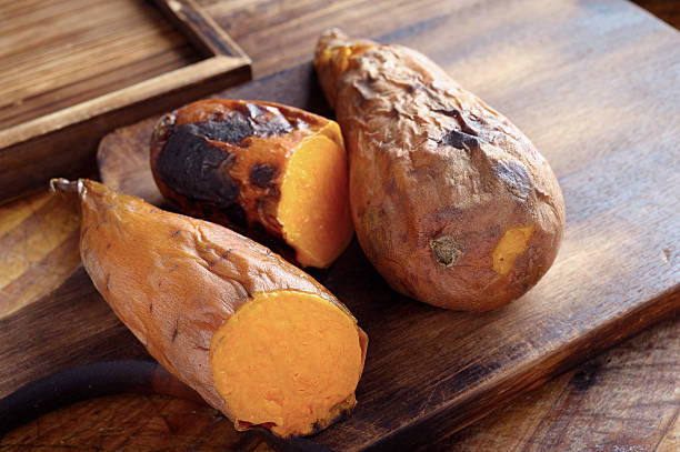 baked sweet potato - sweet potatoes stock pictures, royalty-free photos & images