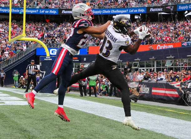 Baltimore Ravens Devin Duvernay catches a 4-yard touchdown reception beating New England Patriots Myles Bryant. The Ravens beat the Patriots 37-26.