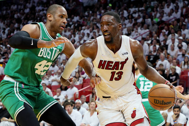 Bam Adebayo of the Miami Heat drives to the basket against Al Horford of the Boston Celtics during the first quarter in Game Seven of the 2022 NBA...