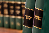 Bankruptcy law books on shelf bookshelf for legal reference