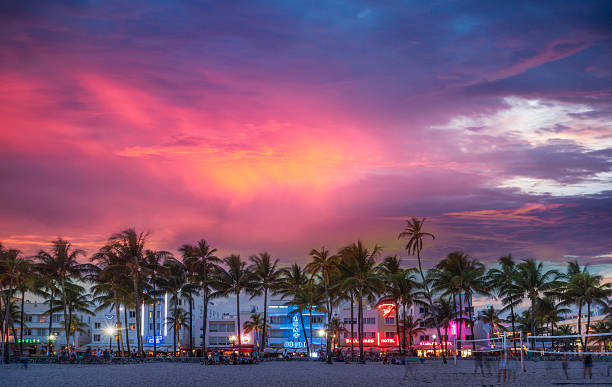 beachfront buildings under sunset sky picture