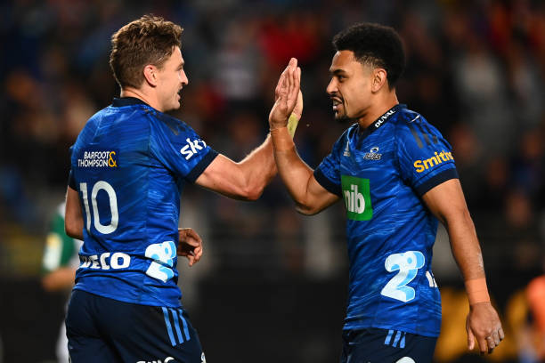 AUCKLAND, NEW ZEALAND - JUNE 04: Beauden Barrett of the Blues celebrates after scoring a try with Stephen Perofeta during the Super Rugby Pacific Quarter Final match between the Blues and the Highlanders at Eden Park on June 04, 2022 in Auckland, New Zealand. (Photo by Hannah Peters/Getty Images)