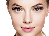 Beautiful woman face with eyelashes beauty healthy skin natural makeup.