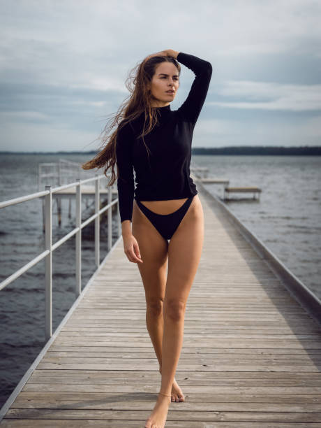 Beautiful young woman walking on pier,Horsens,Denmark