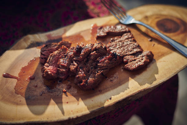 beef steak cut on chopping board picture