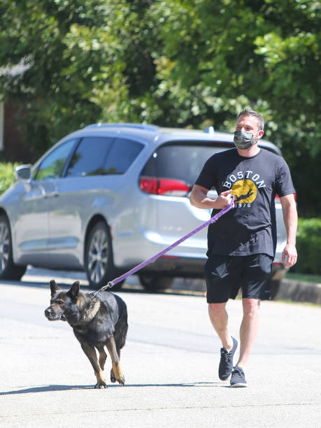 Ben Affleck wearing a face mask while walking a dog on April 25 2020 in Los Angeles California
