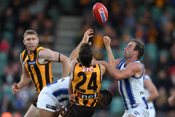 Ben Cunnington of the Kangaroos contests the ball during the round 9 AFL match between the Hawthorn Hawks and the North Melbourne Kangaroos at...