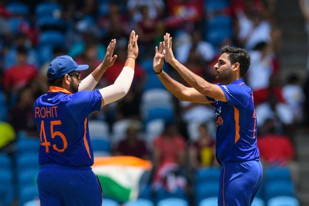Bhuvneshwar Kumar and Rohit Sharma of India celebrates the dismissal of Sharmarh Brooks of West Indies during the 1st T20i match between West Indies...
