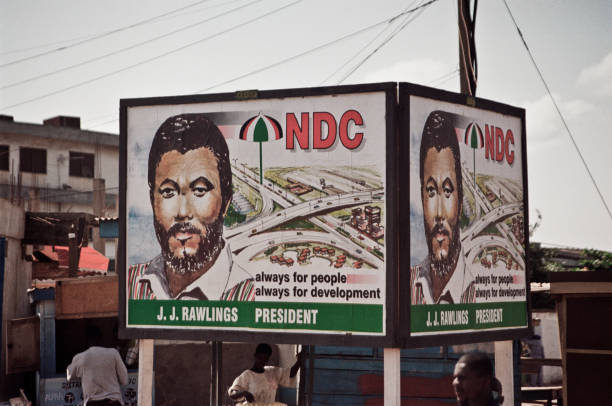 A billboard with election posters for President Jerry Rawlings of the National Democratic Congress party on a street in Accra Ghana ahead of the...