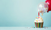 Birthday cupcake with balloons