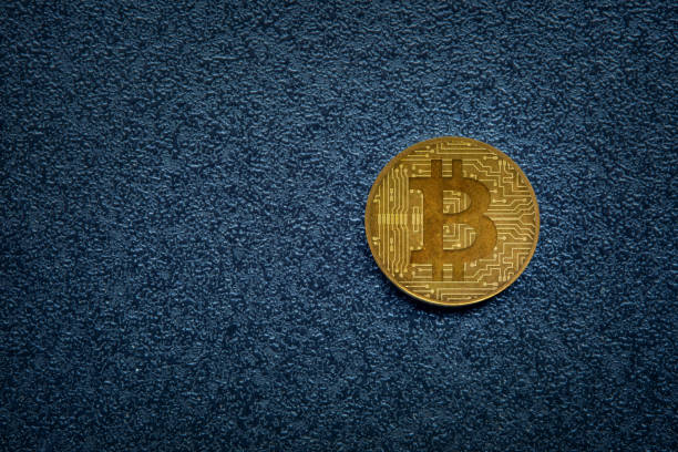 bitcoin on dark background - bitcoin stock pictures, royalty-free photos & images