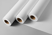 Blank white paper rolls mockup isolated on gray background