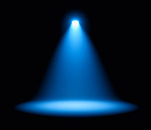 Blue spotlight on stage performance
