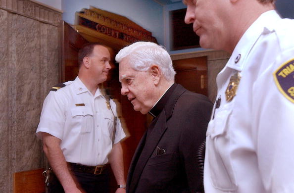 https://media.gettyimages.com/photos/bostons-roman-catholic-cardinal-bernard-law-is-flanked-by-two-court-picture-id51987950?k=6&m=51987950&s=594x594&w=0&h=pHtHLRKta4P_kM9LsIt6qA9RzA37aX14nAOGBGsf9Hg=