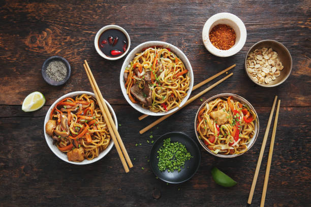 bowls with chicken beef and vegetables chow mein and rice with pork picture