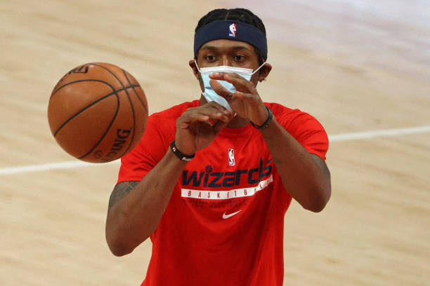 Bradley Beal of the Washington Wizards wears a protective face covering due to the Covid-19 pandemic as he warms up before playing against the...