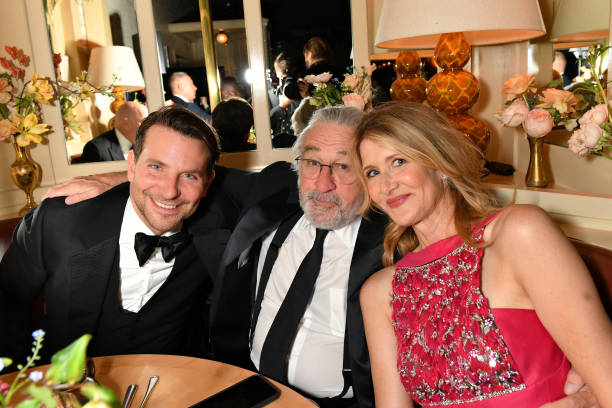 Bradley Cooper Robert De Niro and Laura Dern pose the Netflix BAFTA after party at Chiltern Firehouse on February 2 2020 in London England