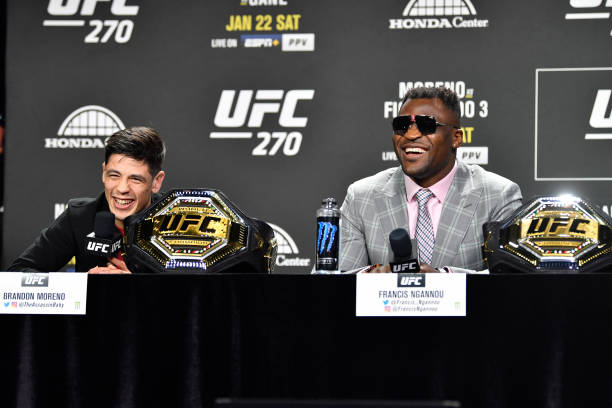 Brandon Moreno of Mexico and Francis Ngannou of Cameroon are seen on stage during the UFC 270 press conference at the Anaheim Convention Center on...