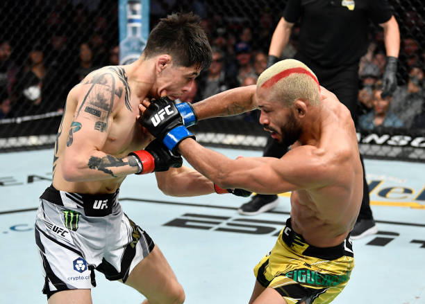Brandon Moreno of Mexico battles Deiveson Figueiredo of Brazil in their UFC flyweight championship fight during the UFC 270 event at Honda Center on...