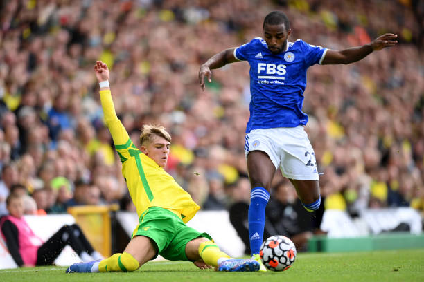 Brandon Williams of Norwich City takles Ricardo Pereira of Leicester City during the Premier League match between Norwich City and Leicester City at...