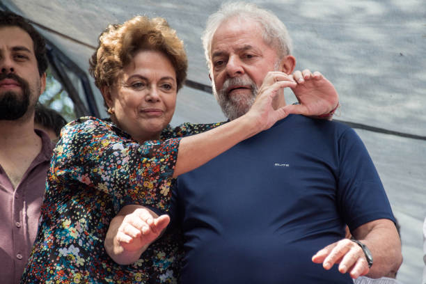 Brazilian expresident Luiz Inacio Lula da Silva and Brazilian former president Dilma Rousseff gesture after during a Catholic Mass in memory of...