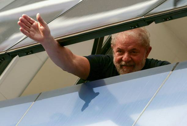 Brazilian former president Luiz Inacio Lula da Silva waves from a window of the Metallurgical Union in Sao Bernardo do Campo Sao Paulo state Brazil...
