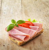 bread with sliced pork ham