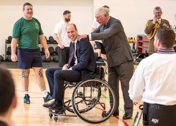 Britain's Prince Charles Prince of Wales consoles his son Britain's Prince William Duke of Cambridge after he threw a basketball from a wheelchair...'s Prince Charles Prince of Wales consoles his son Britain's Prince William Duke of Cambridge after he threw a basketball from a wheelchair...