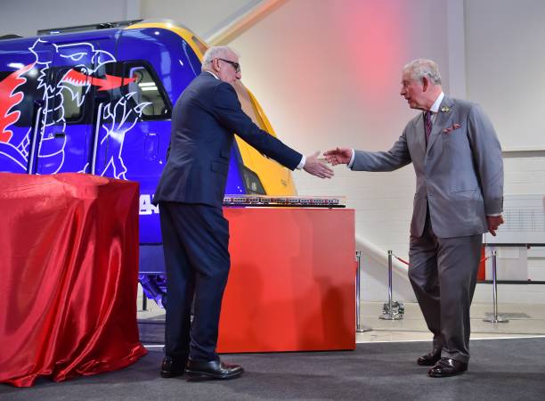 Britain's Prince Charles Prince of Wales shakes hands with chief executive Andres Arizkorreta during a visit to the CAF train factory in Newport...