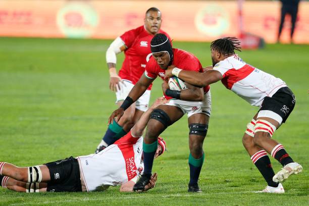 British and Irish Lions' English lock Maro Itoje (2nd R) is tackled by Lions' lock Reinhard Nothnagel (L) and Lions' flanker Vincent Tshituka (R) during the rugby union tour match between the Lions and the British and Irish Lions at the Ellis Park stadium in Johannesburg on July 3, 2021. (Photo by PHILL MAGAKOE / AFP) (Photo by PHILL MAGAKOE/AFP via Getty Images)