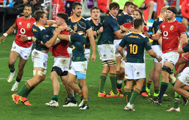 CAPE TOWN, SOUTH AFRICA - JULY 14: British & Irish Lions player Tom Curry gets to grips with South Africa A player Rynhardt Elstadt (l) during the match between South Africa A and the British and Irish Lions at Cape Town Stadium on July 14, 2021 in Cape Town, South Africa. (Photo by David Rogers/Getty Images)