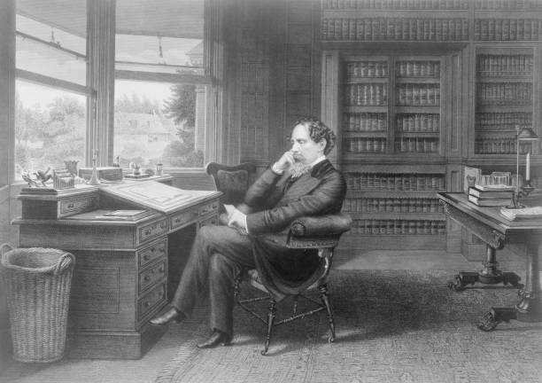 British novelist Charles Dickens sat in his study in Gads Hill near Rochester, Kent circa 1860