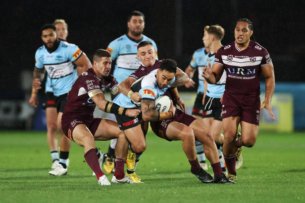 Briton Nikora of the Sharks is tackled during the round seven NRL match between the Manly Sea Eagles and the Cronulla Sharks at Central Coast Stadium...