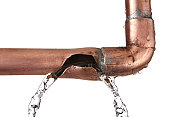 broken leaking copper water pipe