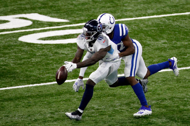 Brown of the Tennessee Titans attempts to catch a pass against Xavier Rhodes of the Indianapolis Colts during their game at Lucas Oil Stadium on...