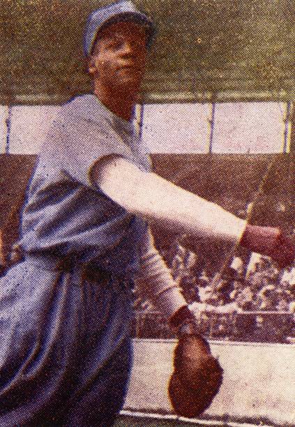 Buck O'Neil, playing first base for the Almendares Scorpions in the Cuban winter league, poses for this photo baseball card, issued in 1948 in Havana.